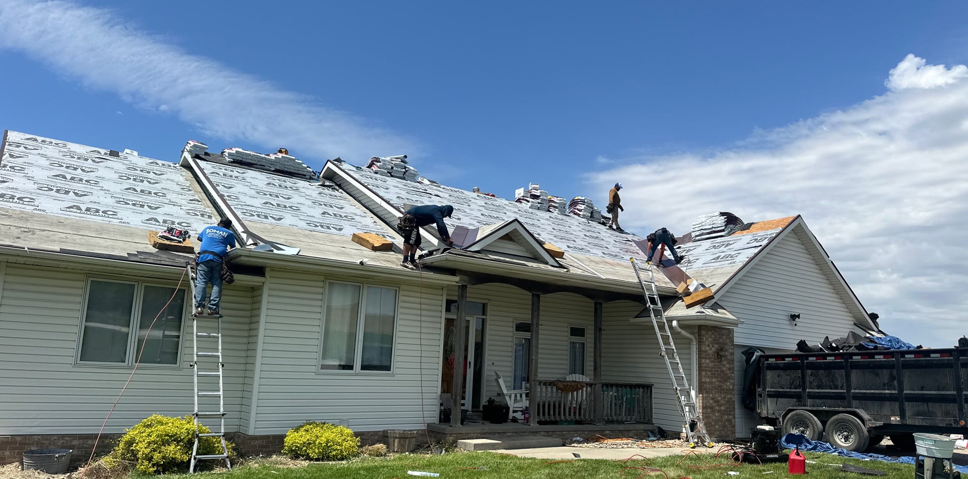 Roofing crew mid tear off and install