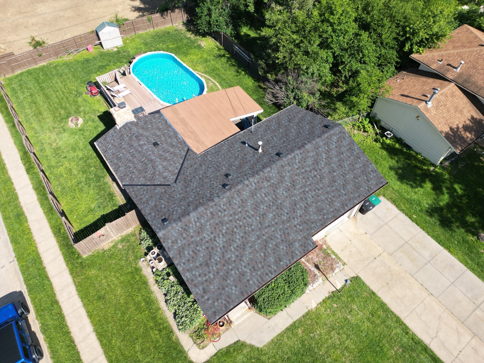 Wide aerial of a finished charcoal roof