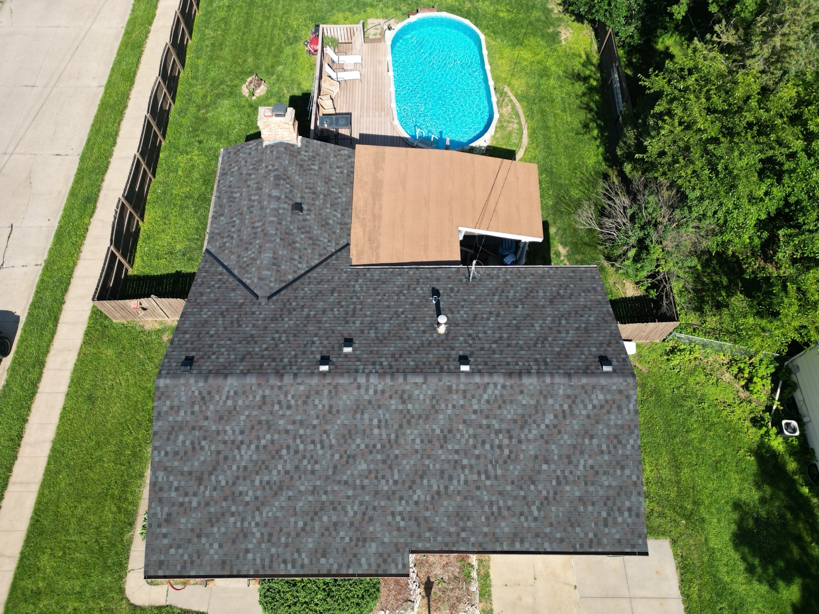 Aerial view of a new gray shingle roof