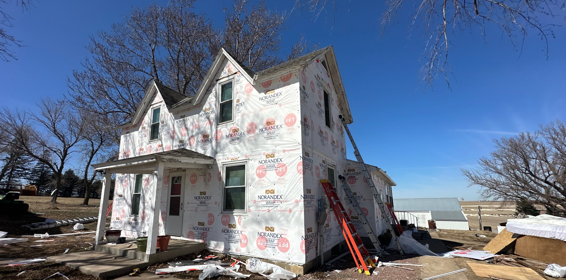 Home wrapped and prepped for new siding